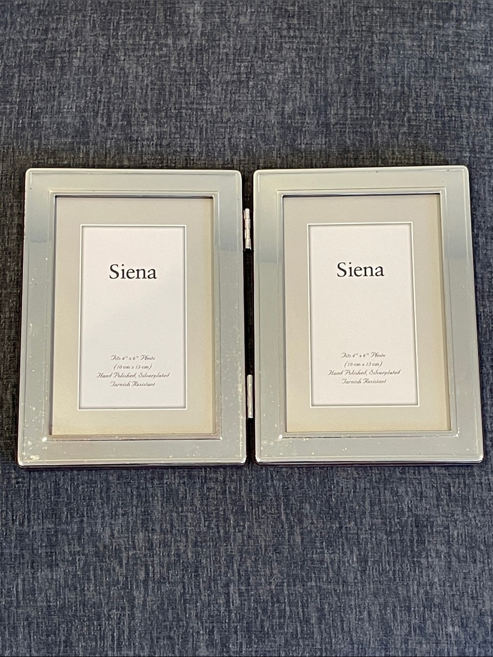 Stand-up silverplated two-photo frame by Siena, fits 4x6 photos